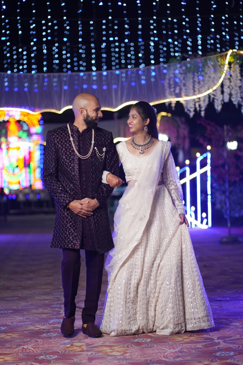 Sherwani, lehenga, and blue lights